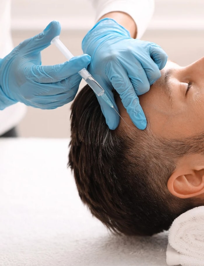 man doing acell treatment at head